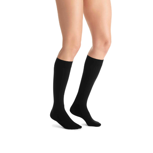 Jobst Opaque knee-high compression stockings in classic black, medium size.